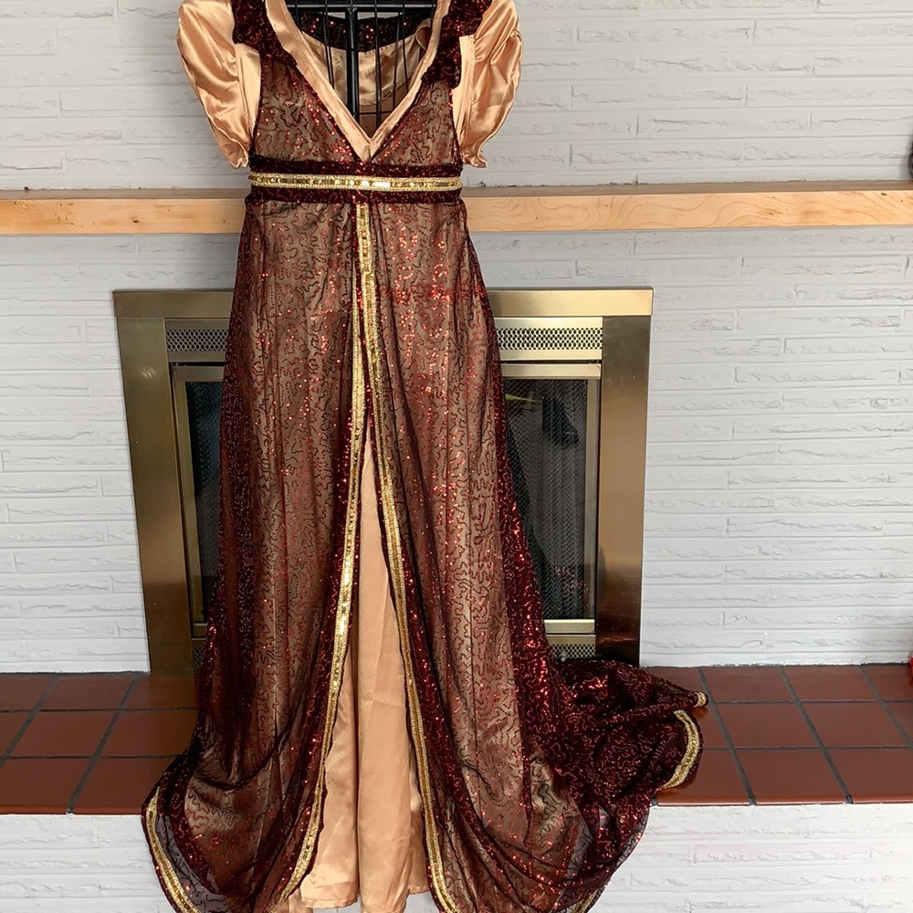Black, red, and gold, sequin gown cover up (gown sold separately.)